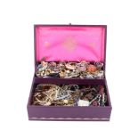 A jewellery box containing a quantity of vintage and cotemporary costume jewellery
