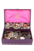A jewellery box containing a quantity of vintage and cotemporary costume jewellery