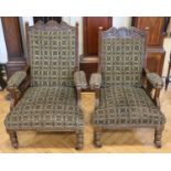 A pair of Victorian upholstered and carved walnut lounge armchairs