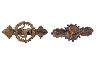 Two Victorian gilt-faced silver brooches, one decorated with a triskelion, the other a ping pong