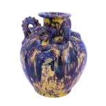A Chinese Sancai glazed earthenware / stoneware dragon vase, of ovoid form with short flared neck,