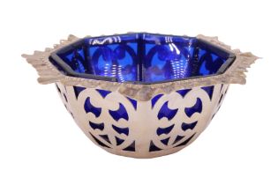 An Edwardian pierced silver octagonal basket, having a cobalt blue glass liner, J.M, Chester,