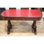 A Georgian mahogany writing table, having a rounded oblong top with a gilt tooled red leather
