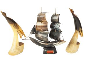 Three ox horn sculptures comprising a ship and a pair of horn bird sculptures, third quarter 20th