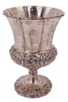 A George IV silver goblet, of campana form having a subtly cusped rim, the body and foot decorated