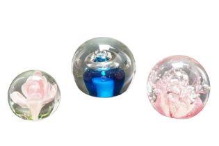 Three late 20th Century glass paperweights, 9 cm largest diameter