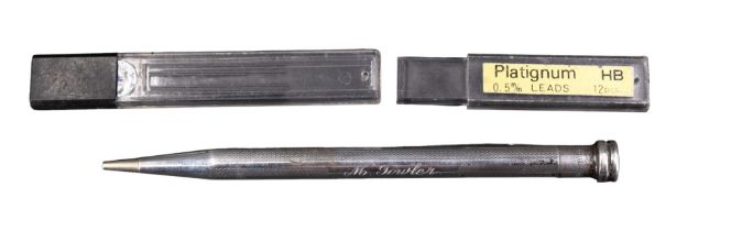 A white-metal "Life-Long" propelling pencil, engine turned and engraved "M Fowler", marked "