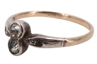 A vintage engagement ring, comprising a pair of paste stones set in white metal on a yellow metal