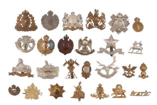 A group of cap and other badges including a Cameronians piper's glengarry badge