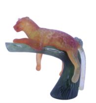 A Daum pate de verre leopard, modelled lounging on a bough, 15 cm