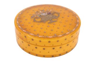 A late 18th Century French circular yellow horn snuff box, the top decorated in piqué work with