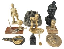 A collection of mining related sculpture, etc