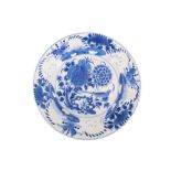 A Kangxi Chinese export blue-and-white porcelain plate, decorated in depiction of a bird within