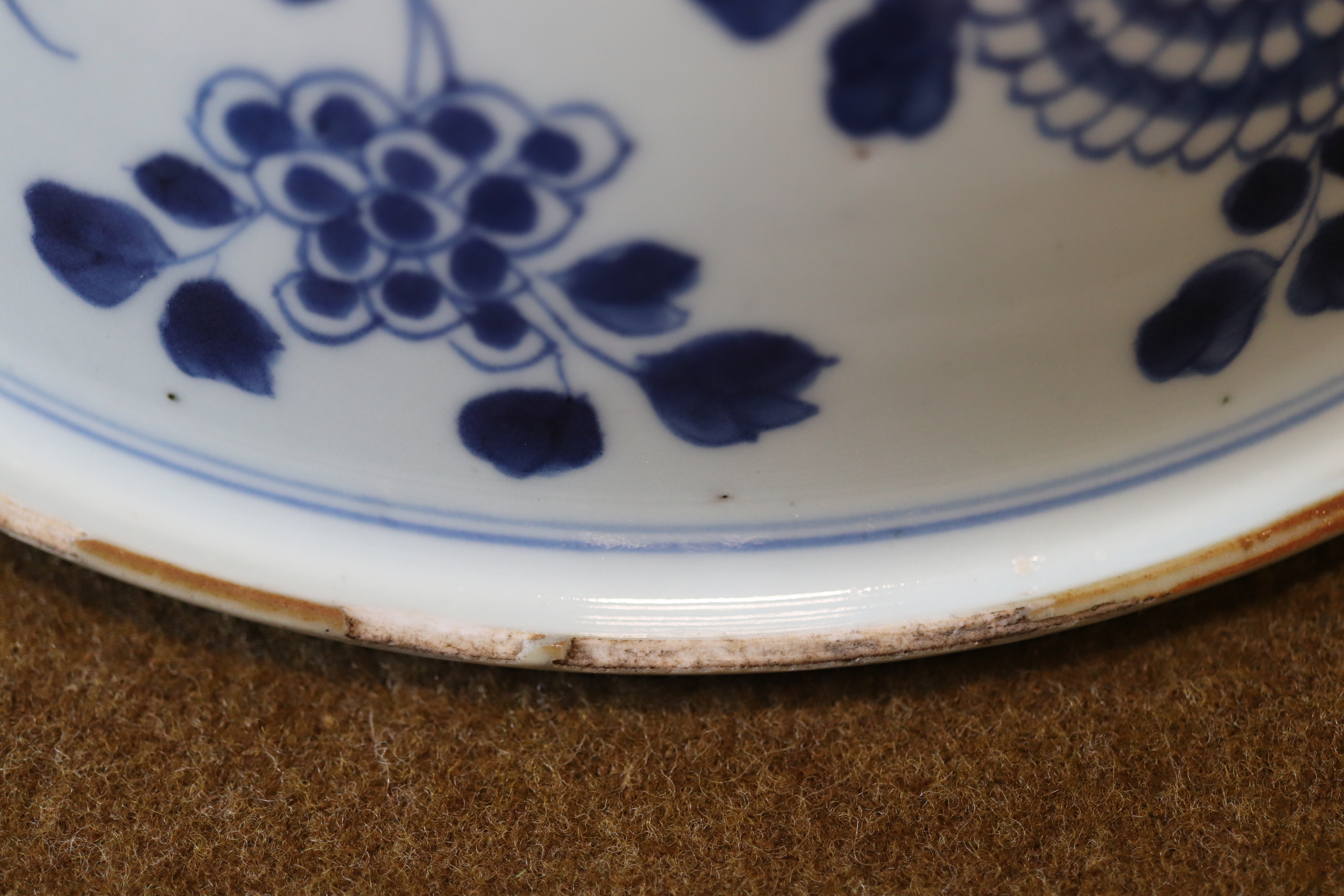 A late Quing Chinese blue-and-white porcelain bowl, circular with down-turned everted rim, decorated - Image 8 of 9