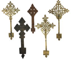 A group of Ethiopian / African Coptic crosses in brass and carved wood, circa 1960s / 1970s, largest