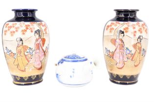 A pair of mid 20th Century Japanese vases, 20 cm, together with a blue and white teapot