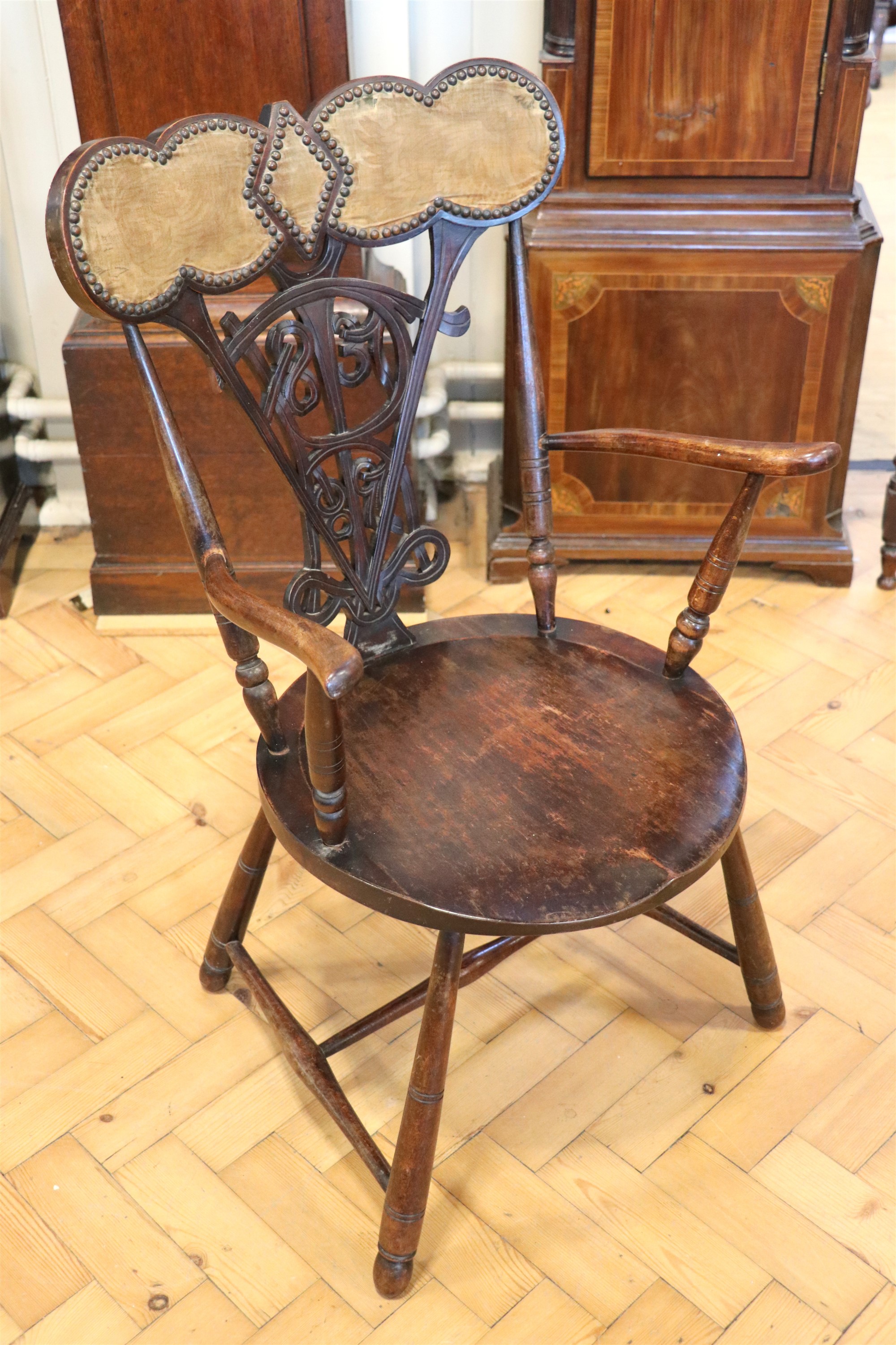 A Victorian golden Jubilee stud upholstered mahogany commemorative open armchair, the backsplat