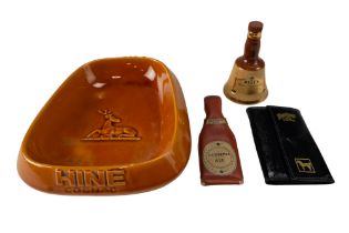 Four items of breweriana, comprising a Hine Cognac ceramic ashtray, a White Horse Whisky calf