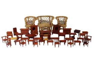 A group of vintage wooden doll's house furniture, including tables, chairs, wardrobes, etc, together