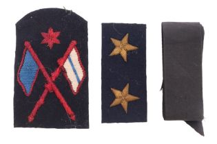 A Second World War Royal Navy HMS cap tally together with a signaler's and one other badge