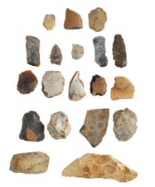 An old collection of prehistoric flint implements including arrow heads, scrapers, etc