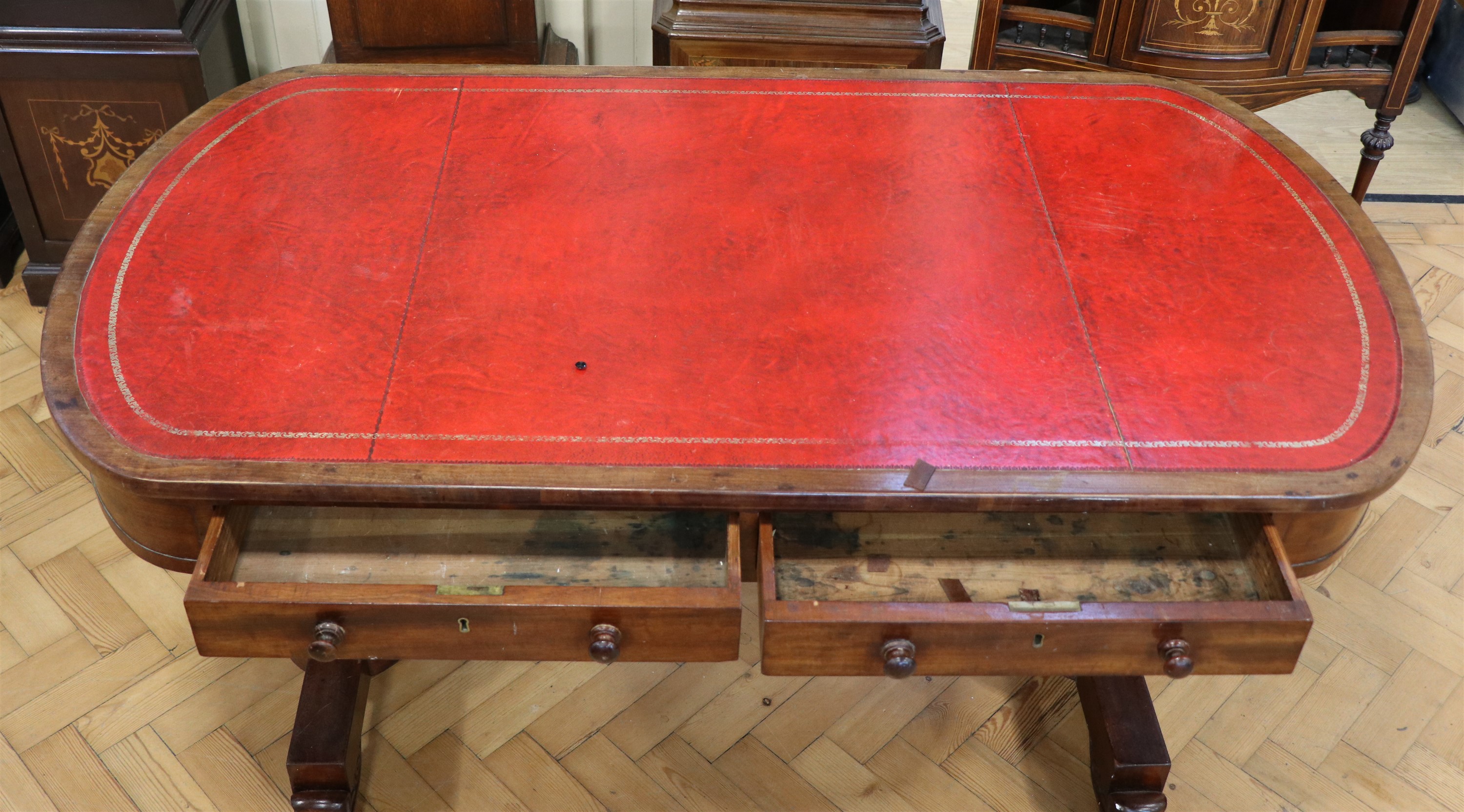 A Georgian mahogany writing table, having a rounded oblong top with a gilt tooled red leather - Image 2 of 4