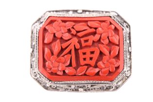 A vintage filigree white metal mounted Chinese cinnabar lacquer brooch, circa 1930s, 4 cm x 3.5 cm