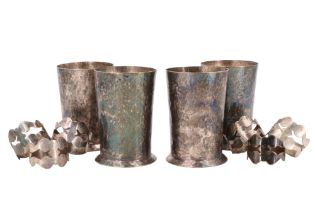 Four electroplate planished beakers and six napkin rings, former 114 mm