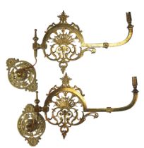 A pair of Victorian gas wall lamps having brass brackets, converted