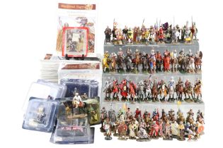 A large quantity of diecast medieval warrior figures and booklets