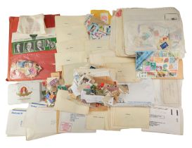A large collection of loose GB and world stamps together with a group of album pages