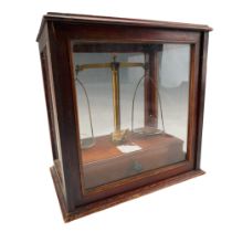 A set of mahogany and brass analytical balance scales, comprising a set of freestanding scales