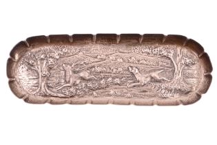 A Victorian silver pin dish, repousse decorated in depiction of a deer hunting scene, engraved "