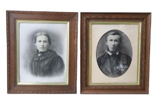 A pair of Victorian photographic prints respectively depicting a lady and a gentleman, in gilt slips