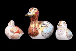 Three Royal Crown Derby duck paperweights comprising 'Teal Duckling', 'Duck' and 'Duckling', all