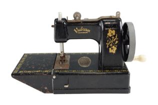 A miniature "Vulcan" toy sewing machine, circa 1955, 16 cm x 23 cm x 11 cm overall