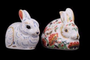 Two Royal Crown Derby rabbit paperweights, both having gold stoppers