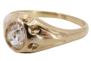 A diamond solitaire ring, the oval cut stone of approx 1 ct gypsy set on a heavy 18 ct yellow