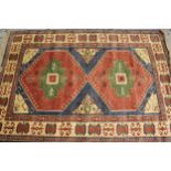 Modern Turkish rug with a twin medallion design in shades of pink, green and blue, 249cms x 174cms