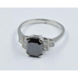 Platinum Deco style ring set with central square cut black diamond flanked by diamonds, size 'N'