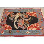 Modern Turkish Kelim rug with a stylised floral design on a black ground with borders, 2.6 x 1.7m