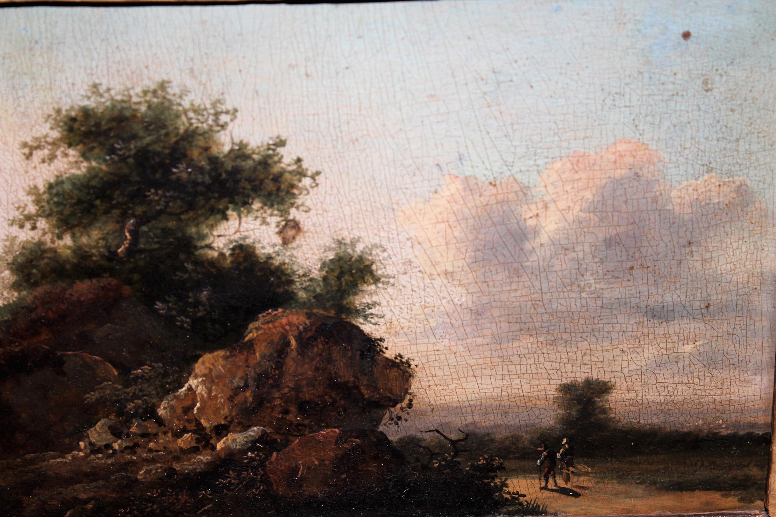 Late 18th / early 19th Century oil on panel, figures on a track with rocks to the foreground,