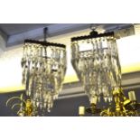 Pair of square gilt brass and glass three tier lustre light fittings