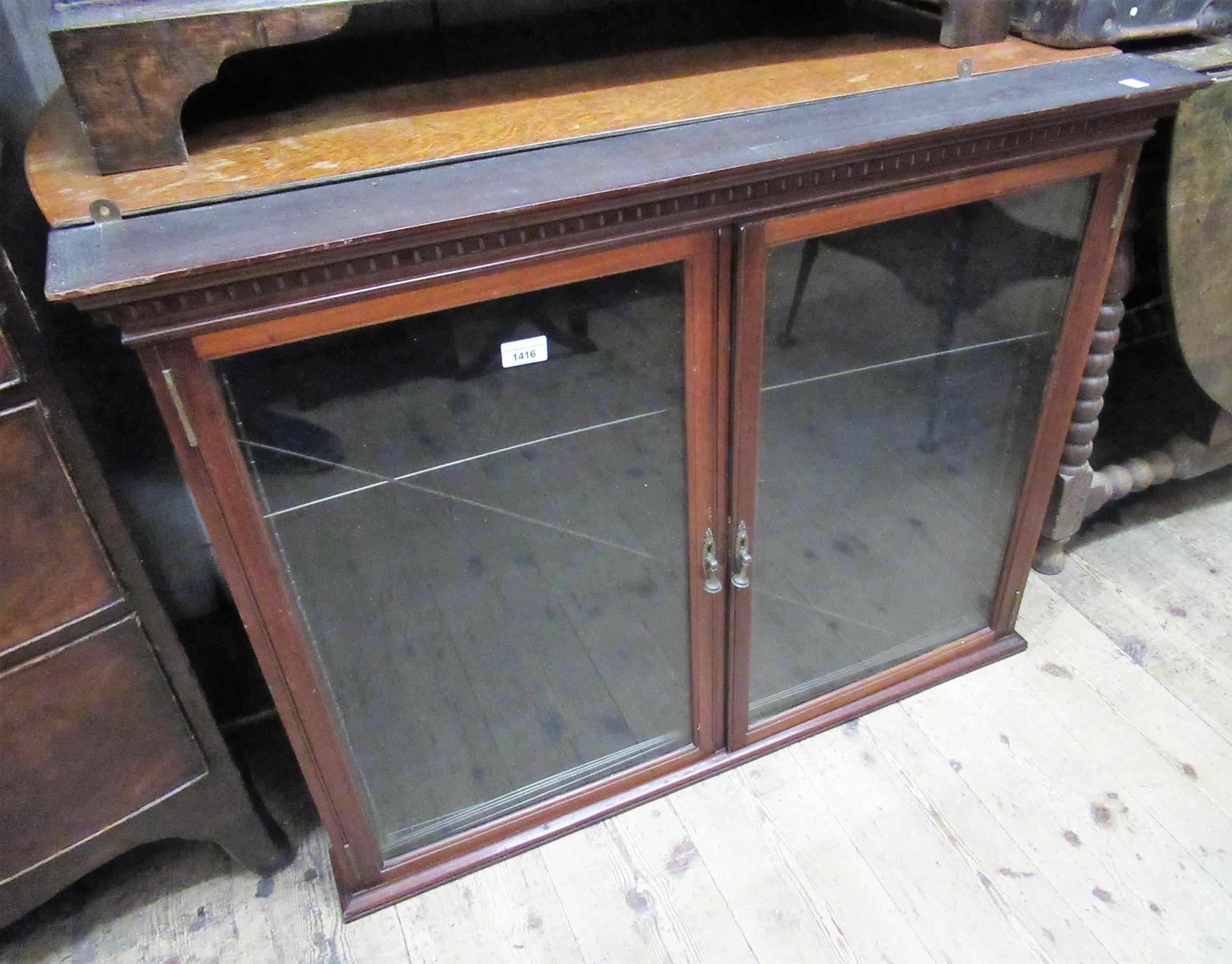 Late 19th / early 20th Century mahogany medal / collectors cabinet with two glazed doors enclosing