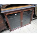 Late 19th / early 20th Century mahogany medal / collectors cabinet with two glazed doors enclosing