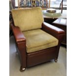 1930's Brown rexine covered club type armchair on low bun front supports