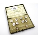 Cased set of six early 20th Century 9ct gold mounted mother of pearl dress studs, with cufflinks