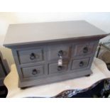 Low side cabinet of six small short drawers, with painted finish and panelled sides