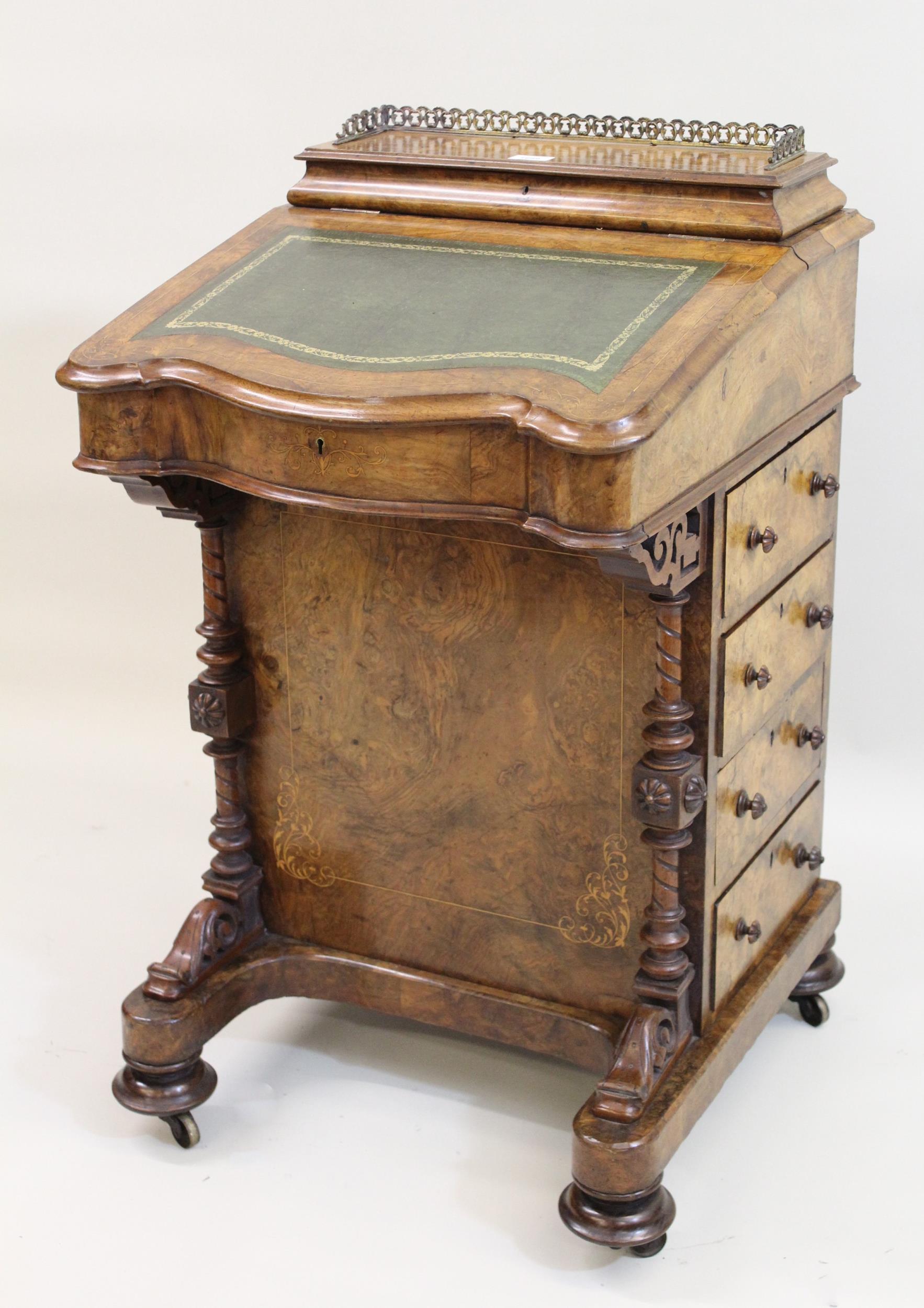 Victorian figured walnut Davenport, the fitted stationery compartment with a hinged galleried lid,