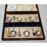 Cased set of six silver coffee spoons, the handles set with coloured stones